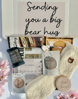 Sending Bear Retirement Gift Box featuring a soft teddy socks, sweet treats, a relaxing foot mask, and a retirement card, beautifully arranged to celebrate this special milestone.