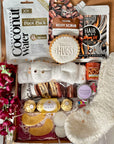 Winter Warmer Cosy Box filled with seasonal comforts such as hot chocolate, fluffy socks, a scented candle, and festive treats, beautifully packed to bring warmth and relaxation