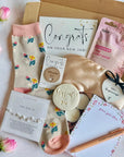 New Job gift box with celebratory treats such as a pen, cookie, socks, stationery, and a congratulatory card, thoughtfully packed to mark a fresh star
