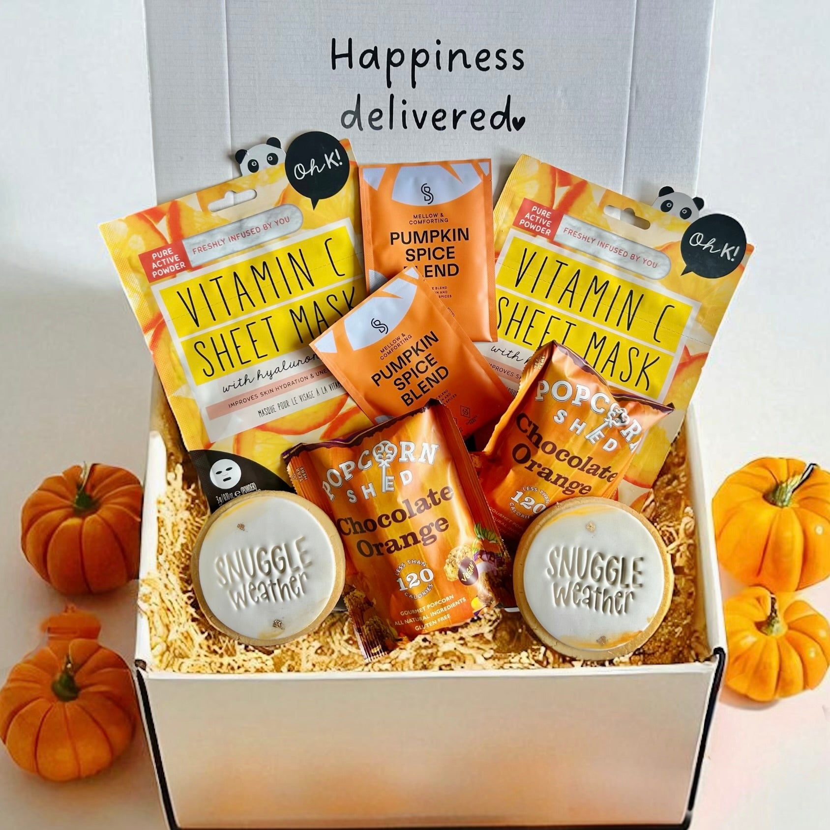 Movie Night In Gift Box featuring popcorn, snacks, hot chocolate, all beautifully arranged in a rustic box with warm, comforting tones perfect for a cozy night indoors