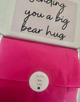 Sending Bear Retirement Gift Box featuring a soft teddy socks, sweet treats, a relaxing foot mask, and a retirement card, beautifully arranged to celebrate this special milestone.