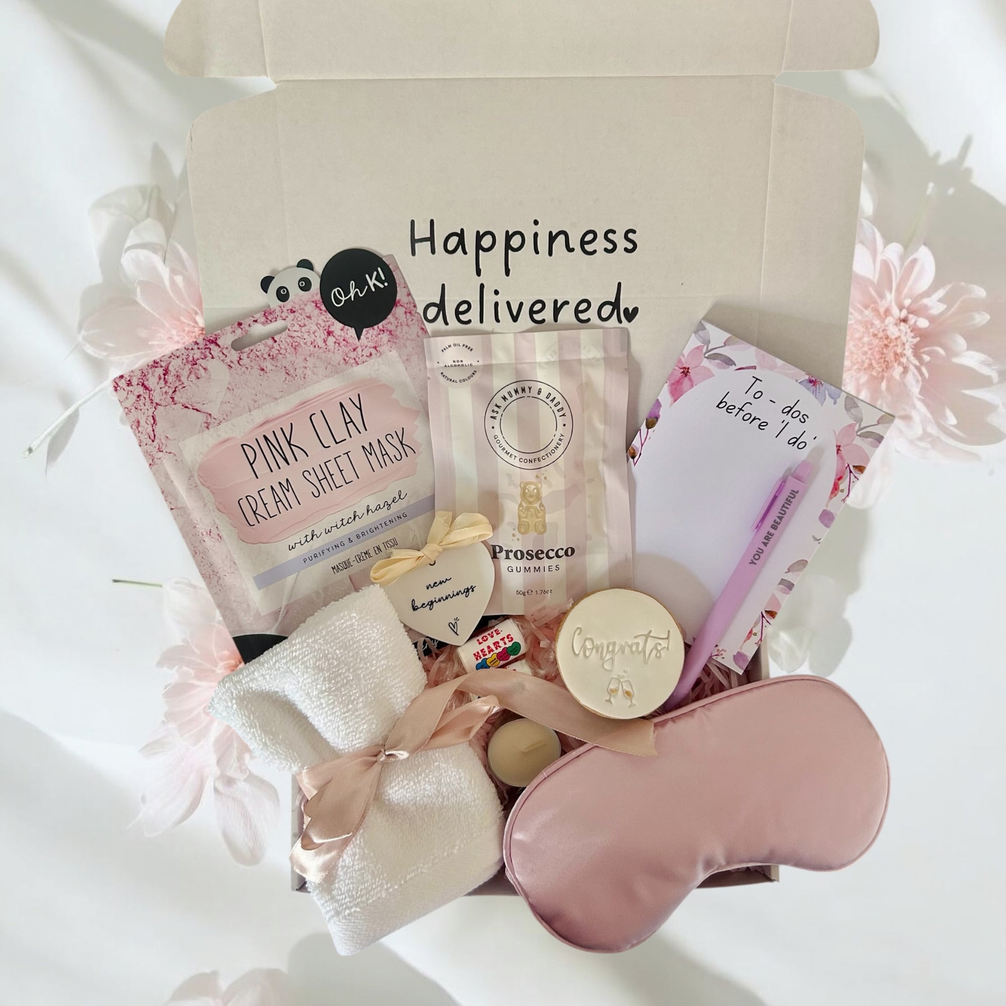 Bride to be gift featuring bridal accessories, pampering treats and celebratory items, beautifully packaged.