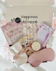Bride to be gift featuring bridal accessories, pampering treats and celebratory items, beautifully packaged.