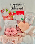 A thoughtful mum-to-be care package with self-care essentials, including cosy socks, Relaxing face mask, a soothing wax melt, Mums time out bath salt, snacks, and a handwritten note, all beautifully arranged in a gift box.