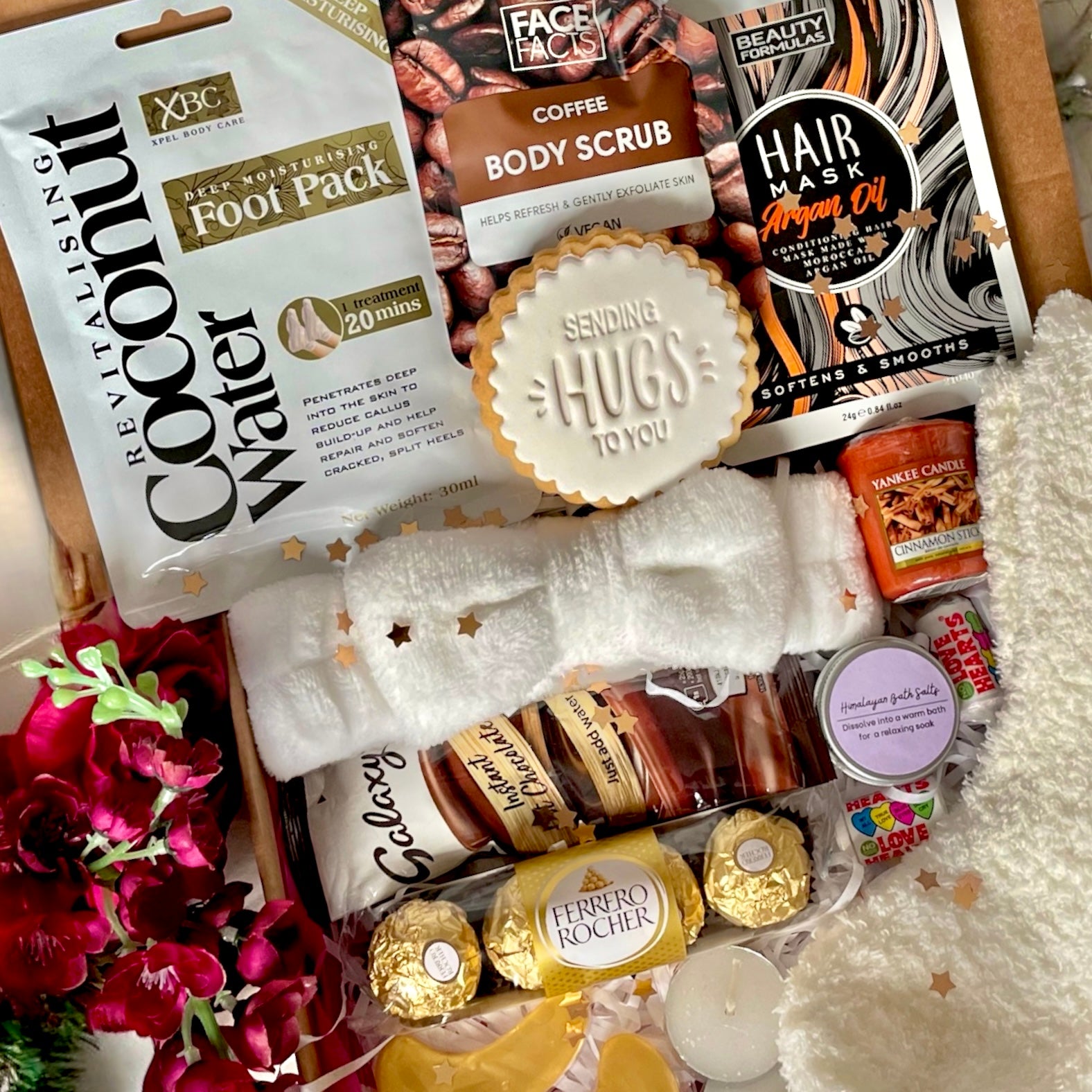 Winter Warmer Cosy Box filled with seasonal comforts such as hot chocolate, fluffy socks, a scented candle, and festive treats, beautifully packed to bring warmth and relaxation