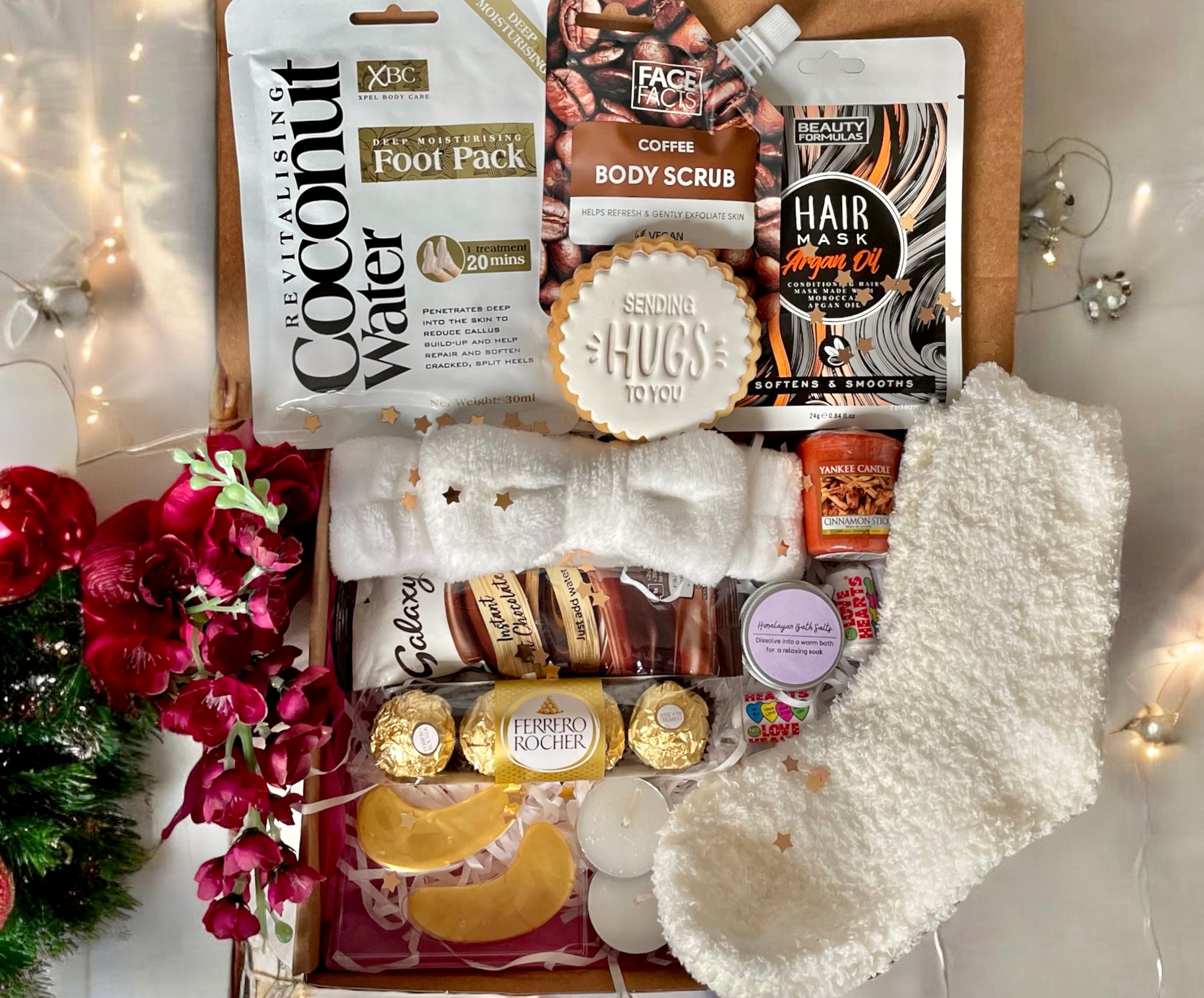 Winter Warmer Cosy Box filled with seasonal comforts such as hot chocolate, fluffy socks, a scented candle, and festive treats, beautifully packed to bring warmth and relaxation